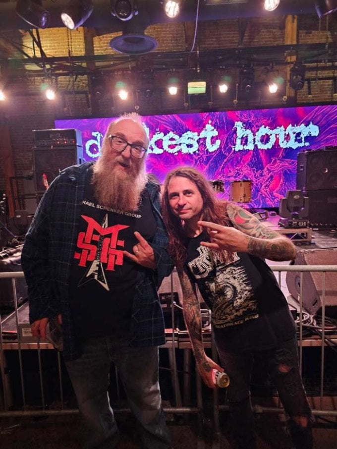 Brian Posehn Photographed With Darkest Hour Holding Mike Schleibaum’s Guitar